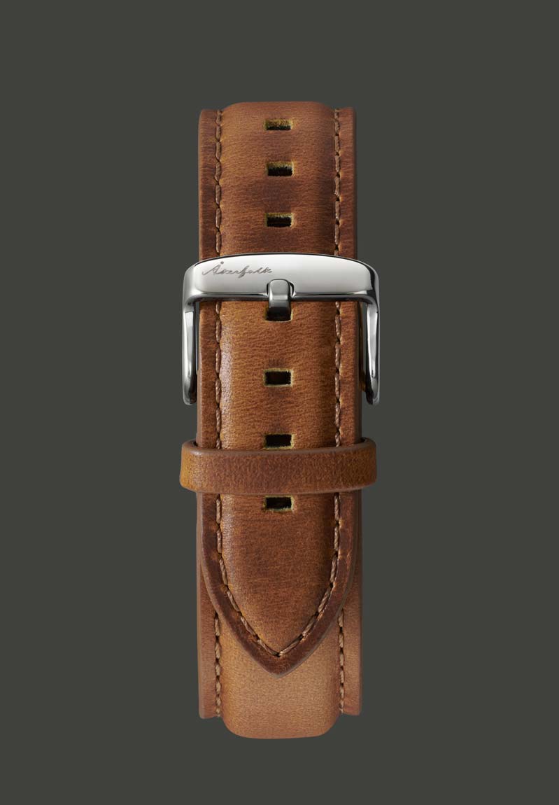A light brown leather watch strap with a stainless steel buckle, displayed against a plain background.